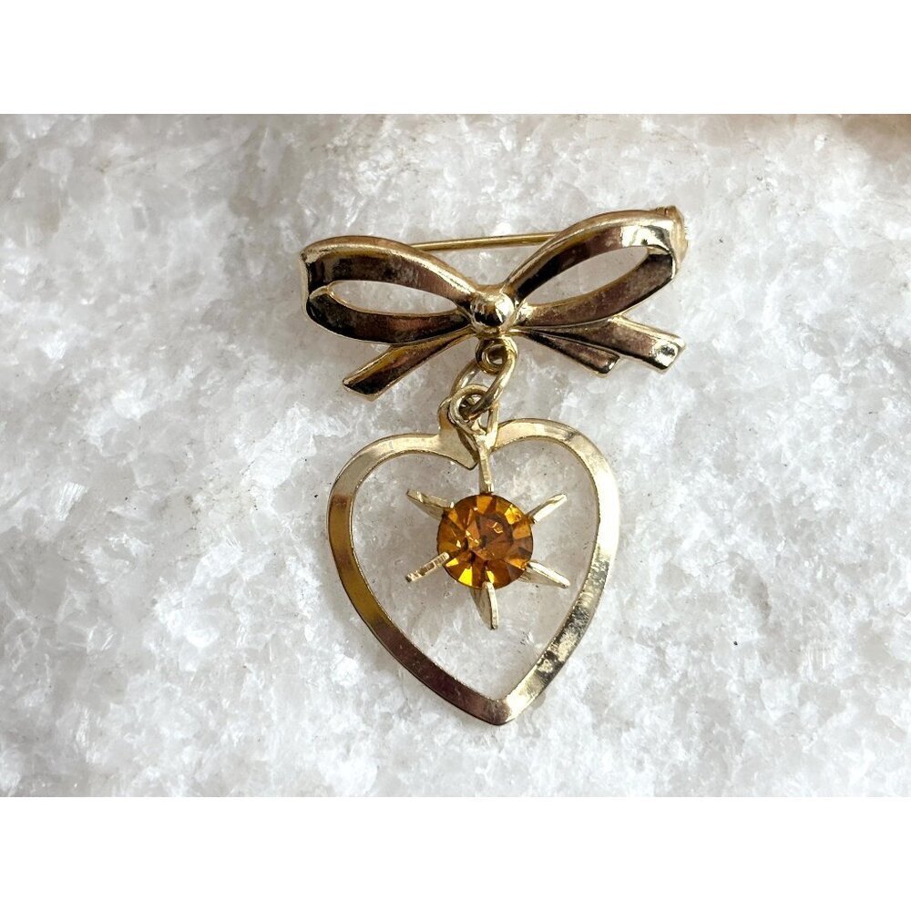 Gold Toned Matte Ribboned Bow Heart Shaped Orange Rhinestoned Brooch